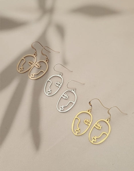 Metal face earrings online